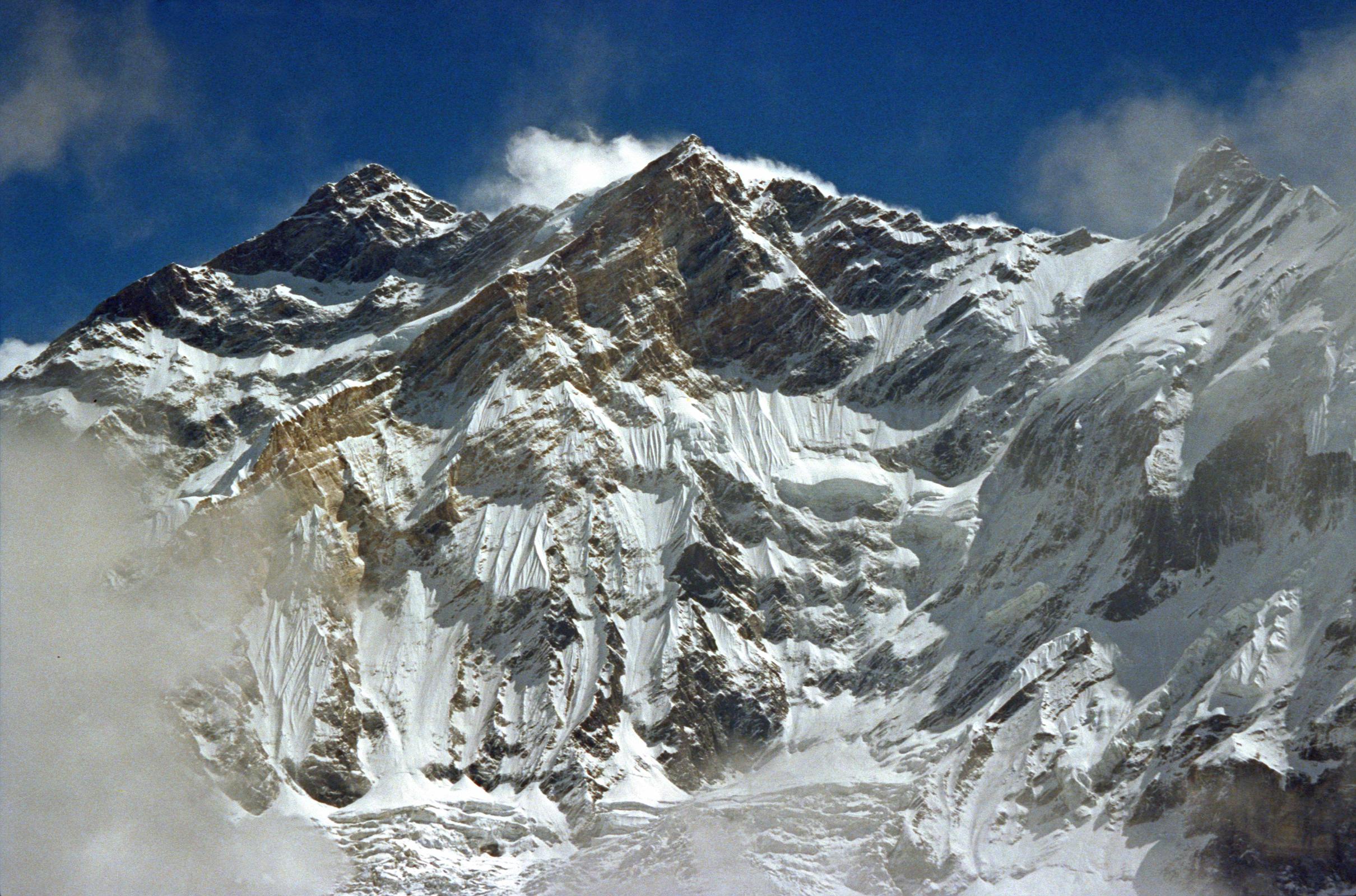 107 Annapurna To Fang From Ridge Above Miristi Khola After crossing the Thulo Bugin, we finally crested the ridge of the Miristi Khola. I could finally see the Annapurna north massif from floor to ceiling - man, it's huge. Clouds and mist covered it for the most part, but the ridge from Annapurna Northwest Face to Fang peaked out once in a while for me.